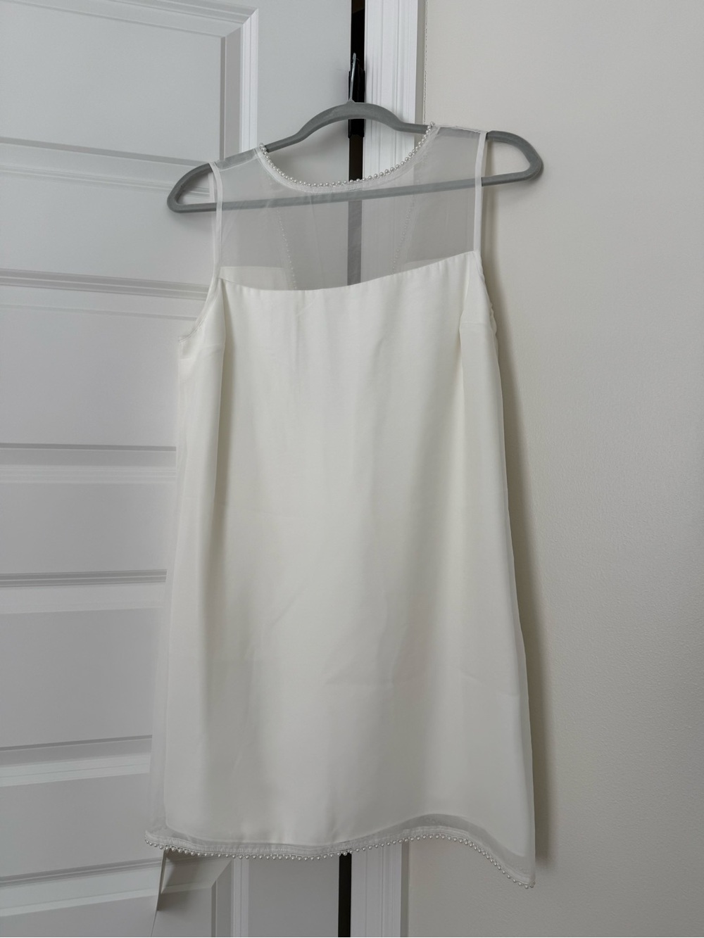 White dress with pearl edges